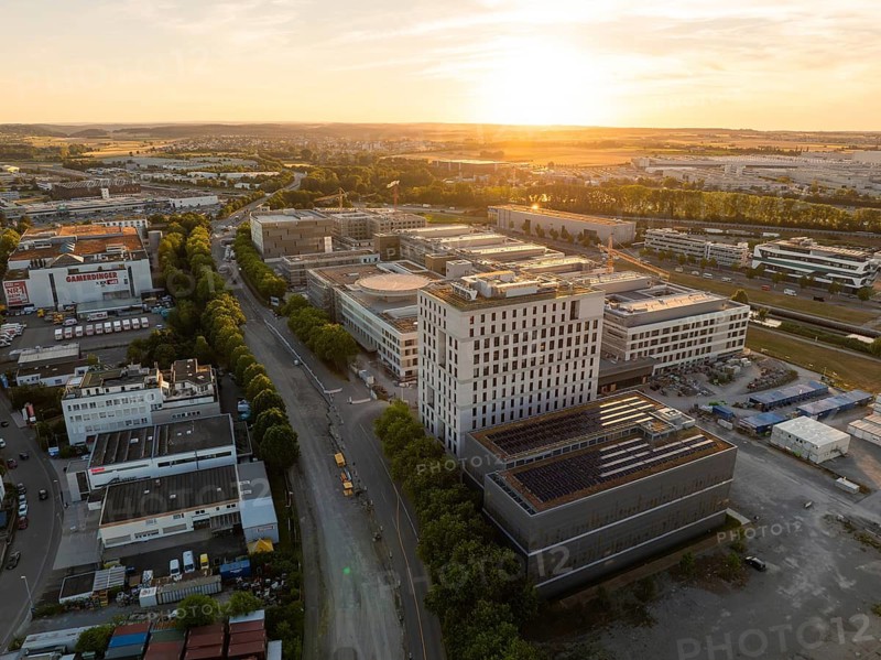 Aerial view of an urban area with modern buildings during sunset, new hospital building, Böblingen airfield, Germany