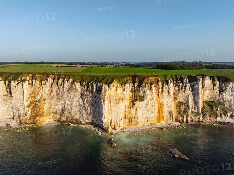 Aerial view of rugged chalk cliffs in the evening sun, Étretat, Alabaster Coast, La Côte d'Albâtre, chalk cliffs, English Channel, Seine-Maritime, Normandy, France