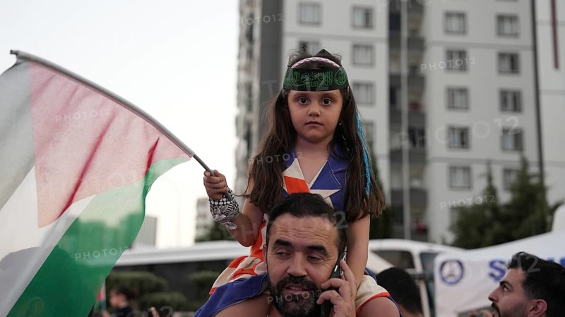 Gaziantep, Turkey - August 06, 2026: Participants of the Palestine Convoy, which set off from Sarajevo, Bosnia and Herzegovina, gather alongside local residents in Gaziantep while waving Palestinian flags to draw global attention to ongoing Israeli attacks on Gaza and the humanitarian crisis in Palestine, Gaziantep, Turkey
