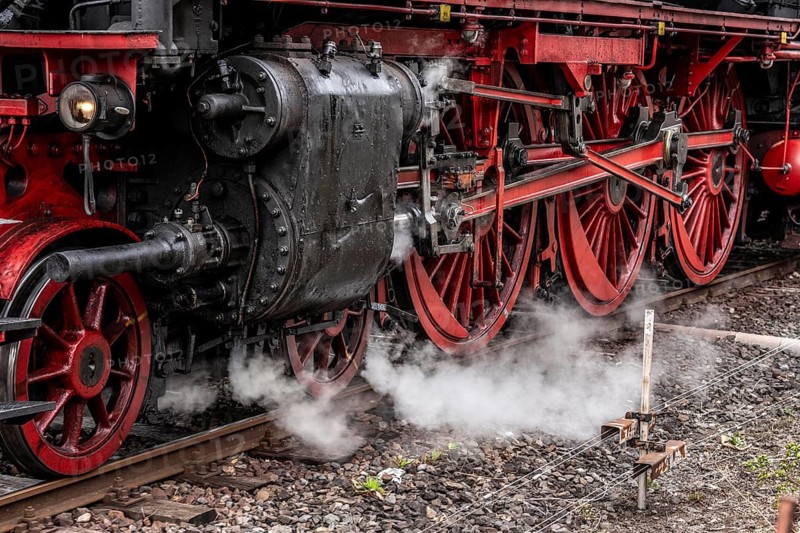 Detailed view of the drive wheels and coupling rods of a steam locomotive, Bochum railway museum, museum days weekend, with many attractions such as steam locomotive rides, 3 locomotives are under steam, historic trains make round trips through the Ruhr Valley, many locomotives can be visited, on the site of the former Dahlhausen railway depot, North Rhine-Westphalia, Germany