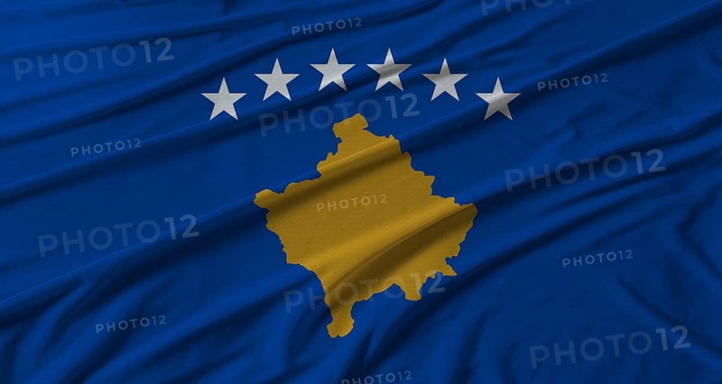 Kosovo flag waving. Flag of Kosovo with cloth texture