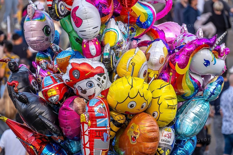Many colorful motif balloons, filled with gas, float, with many different motifs, some comic figures, symbolic figures, as here at the Rheinkirmes, North Rhine-Westphalia, Germany