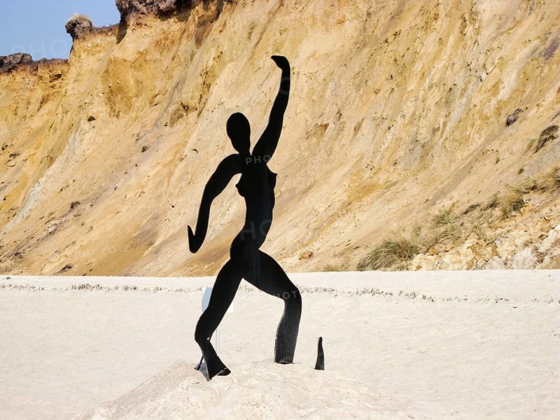 Steel sculpture on a sandy beach, dancer in St Tropez, artist Stefan Szczesny, stylized dancing woman, naked, minimalistic, temporary art project Shadows in the Sand, Sylt Art Festivals 2011, Rotes Kliff, Sylt, Germany