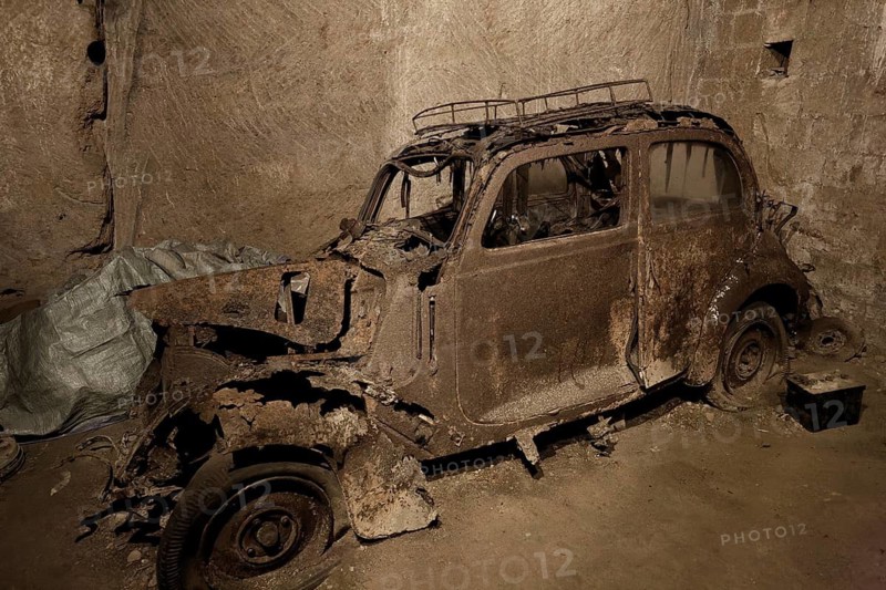 Rotten Lancia Aurelia from the 1950s, car cemetery, Galleria Borbonica, Bourbon Tunnel, underground Naples, Campania province, Italy