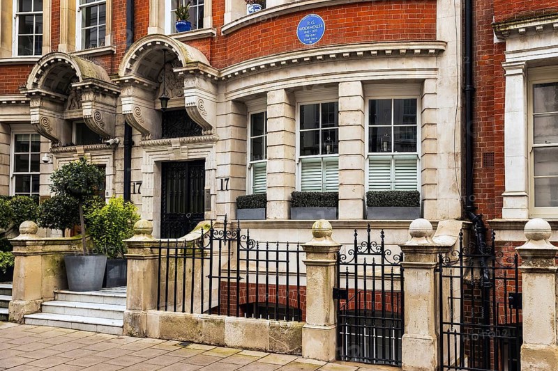 A blue plaque above the entrance of 17 Dunraven Street commemorates author P G Wodehouse, Mayfair, London, England, United Kingdom