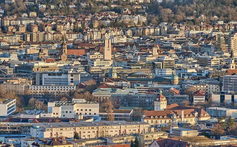 Panoramic view of Stuttgart city center in Germany during spring with warm golden evening light. Dense urban architecture, hills and residential districts captured from an elevated viewpoint, Stuttgart, Baden-Wuerttemberg, Germany