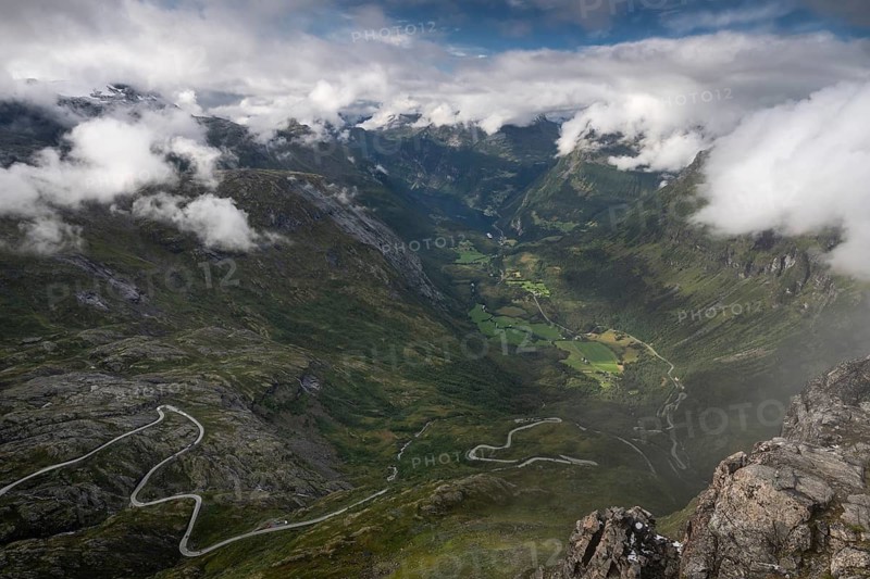 Famous curvy mountain road Fylkesvei 63 or Geirangervegen, which leads from Geiranger to the Djupvasshytta plateau, view of the Geiranger fjord from the 1476 meter high mountain peak and viewpoint Dalsnibba, Stranda, Møre og Romdal, Norway