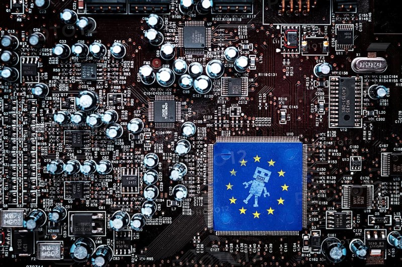 Computer board with EU flag and robot symbol, EU AI Act symbol photo, photo montage +++ editorial use only