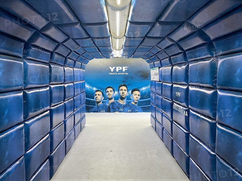 Buenos Aires subway pedestrian tunnel simulates a player tunnel with Argentinean national players Lionel Messi, Enzo Fernández, Rodrigo de Paul and Leandro Paredes as an advertisement for the energy company YPF, Buenos Aires, Argentina
