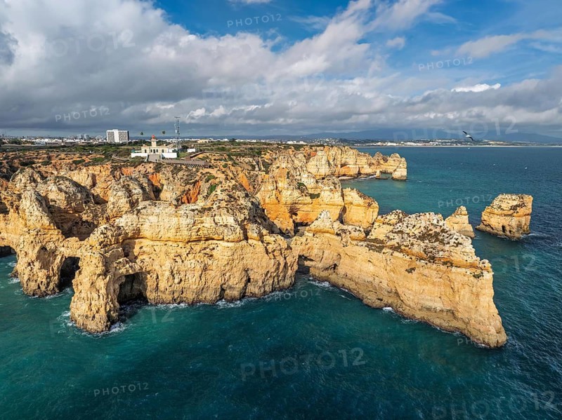 Aerial view of Ponte da Piedade in Lagos, Algarve, Portugal, with sea stacks, ocean spray and coastal cliffs