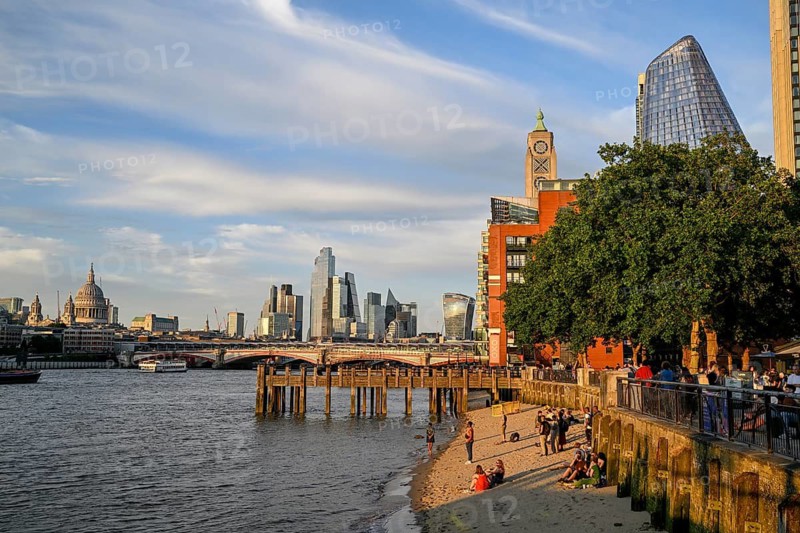 Sandy beach beach on the banks of the Thames near Gabriel's Wharf with views of Blackfriars Bridge and the City of London skyline with skyscrapers 22 Bishopsgate, Leadenhall Building, Cheesegrater, and 20 Fenchurch Street, Walkie Talkie, South Bank, London, England, Great Britain, Great Britain