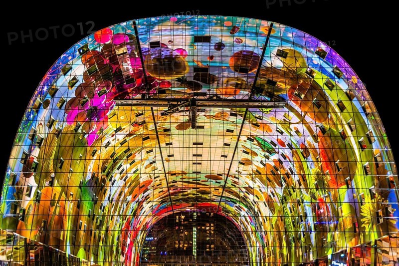 Markthal from 2014, offers over 100 food stalls and delicatessens with spectacular ceiling fresco cornucopia, Horn of Plenty by Arno Coenen and Iris Roskam, Rotterdam, the Netherlands