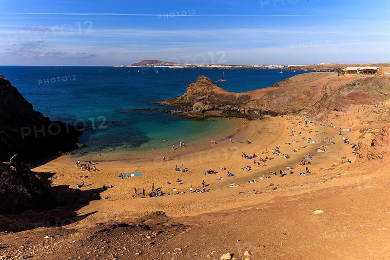Lanzarote, Canary Islands, Spain, Europe, Playas de las Papagayo, sunny beach with bathers and turquoise water, framed by cliffs