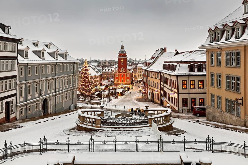 Snowy old town with festive lighting and Christmas tree in a wintry atmosphere, the old town of Gotha in winter