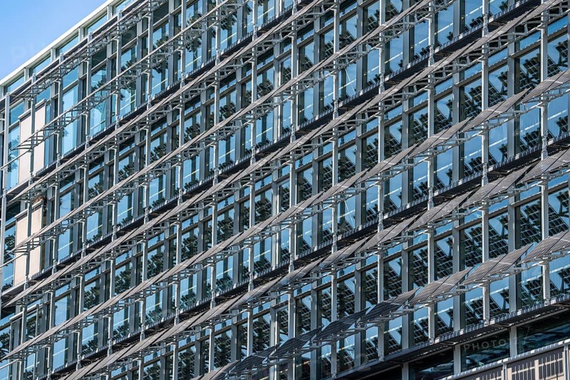 The FLOAT office building in Düsseldorf's media harbor, on Holzstraße, almost 200 meters long façade with movable photovoltaic slats, which on the one hand produce electricity and serve as sun protection for the building, and act as a design element, North Rhine-Westphalia, Germany