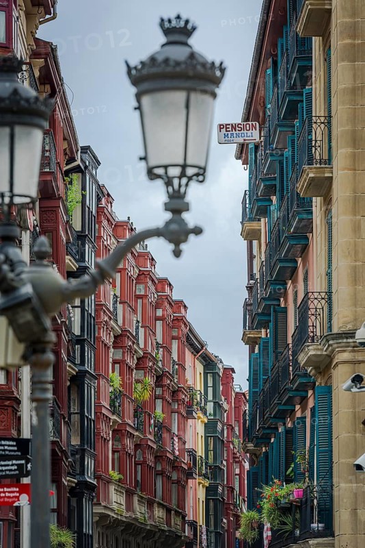 Row of houses with typical street lights in the old town of Bilbao, Basque Country, Spain