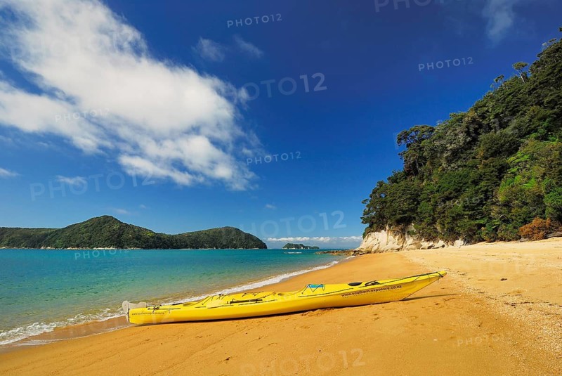 Sandy beach beach, Abel Tasman National Park, Tasman Sea, Nelson Region, South Island New Zealand boat tour, yellow paddle boat on the beach, Abel Tasman National Park, South Island, New Zealand