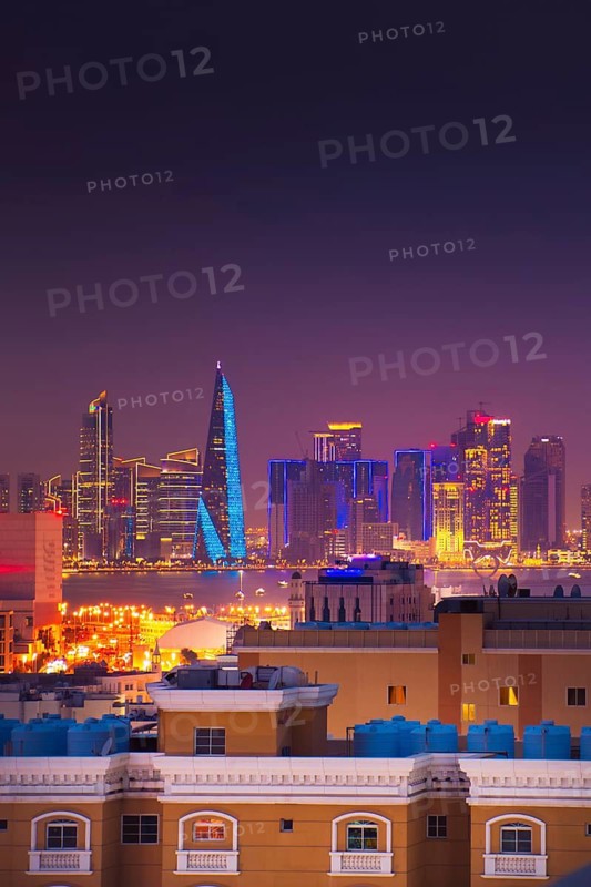 Doha, Qatar - january 8th, 2026: residential area and Doha business hub skyline at night. Iconic illuminated skyscrapers business district luxury middle east gulf colorful night architecture