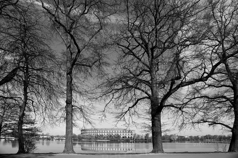 General view of the former, unfinished NSDAP Congress Hall, 1933–1945, with the Dutzenteich pond and lime trees (Tilia platyphyllos) in the foreground, Documentation Centre, Nazi Party Rally Grounds, black and white, Bayernstraße 110, Nuremberg, Middle Franconia, Bavaria, Germany