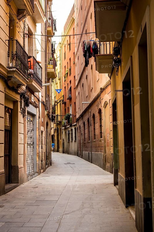 A narrow street in the Gothic Quarter (Barri Gòtic) of Barcelona's Old Town, Spain