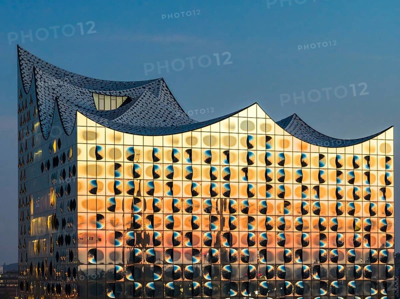 Aerial view of sunrise on the Elbe with Elbe Philharmonic Hall and reflections in the glass façade, Hamburg, Germany