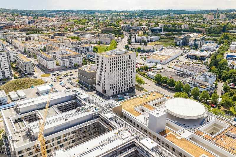 Urban panorama with views of modern buildings and roofs taken from the air, Neubau Krankenhaus, Böblingen airfield, Germany