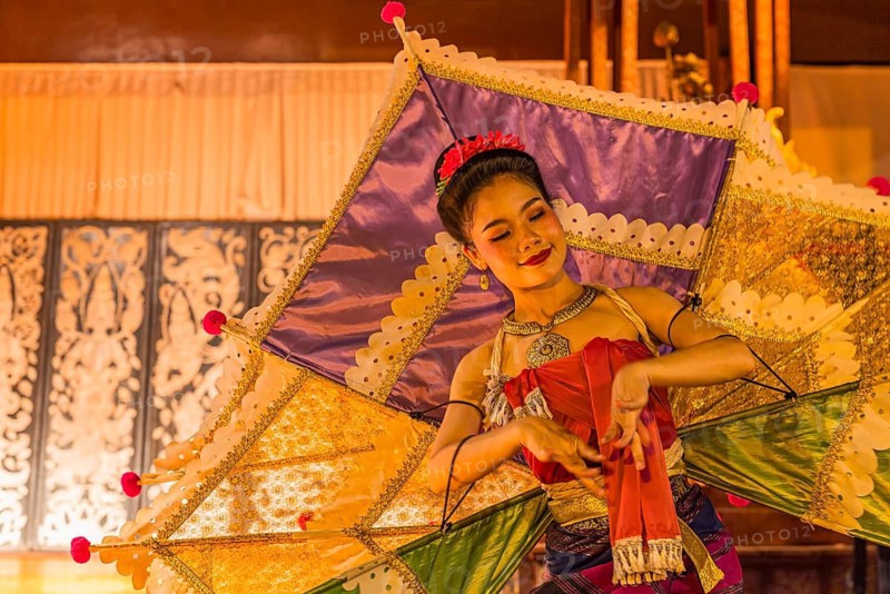 Young Thai woman with fan-like wings showing a traditional dance, Old Chiang Mai Cultural Center, Chiang Mai, Thailand