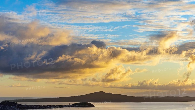 Sunrise clouds above North Head and Rangitoto Island volcano, seen from Mount Eden, Auckland, New Zealand
