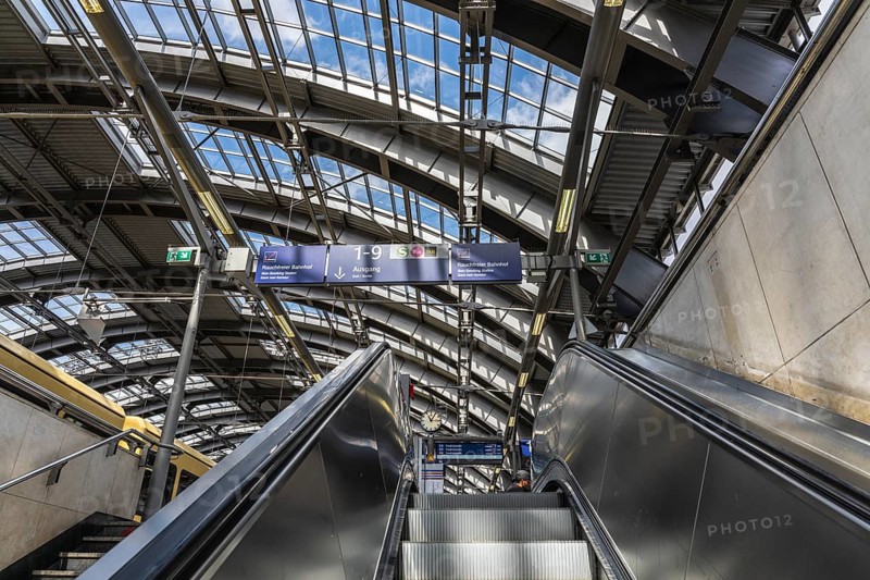 Blue information displays on the escalators leading to the platform at Berlin's Ostbahnhof, Berlin, Germany