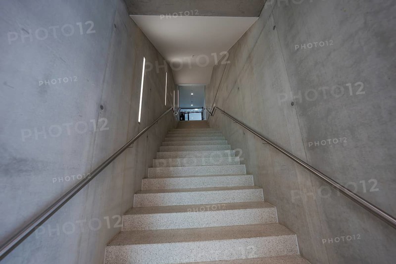 Minimalist concrete staircase flanked by geometric concrete walls, Boarding House des Klinikverbund Südwest, Böblingen, Germany