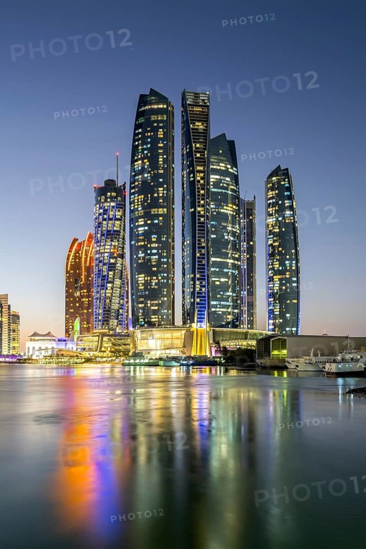 Abu Dhabi Skyline Etihad Towers skyscrapers at night in Abu Dhabi, United Arab Emirates