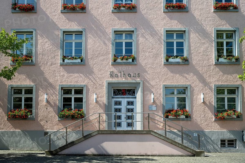 Façade of the town hall, east wing, flower boxes with geraniums in front of the windows, symmetry, Soest, Westphalia, North Rhine-Westphalia, Germany
