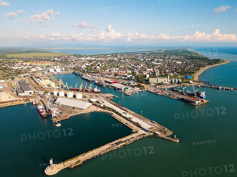 Aerial panorama Poti cityscape, black sea port, residential blocks, mixed uses, roads and parks, waterfront real estate, summer daylight panorama