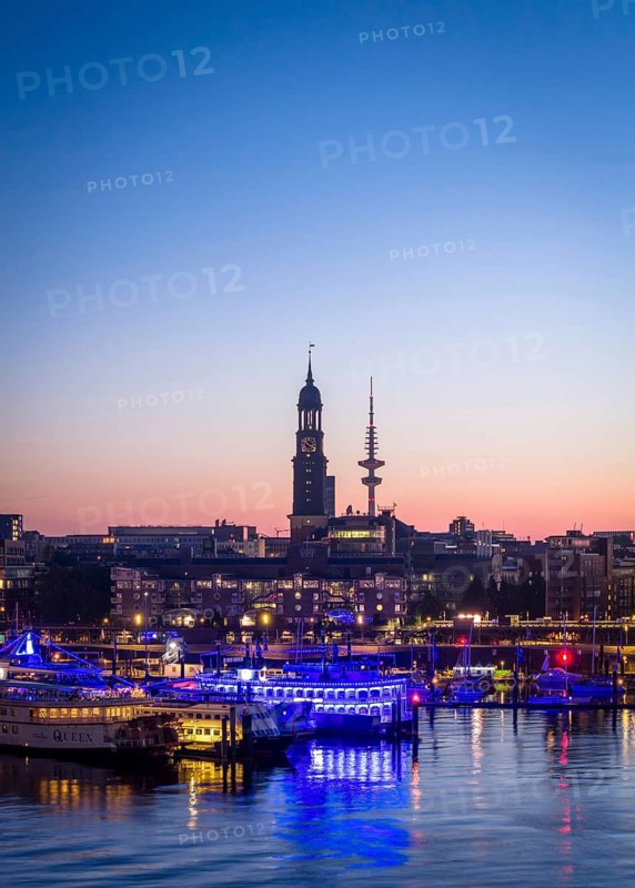 Aerial view of Landungsbrücken at sunrise on the Elbe with St Michael's Church (Michel) and Heinrich Herz Tower, Hamburg, Germany