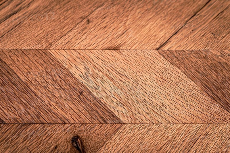 Close-up view of a rustic wooden surface showcasing intricate natural textures and patterns, background with copy space