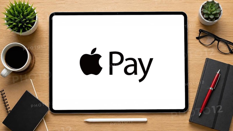 In this photo illustration, an iPad displays the Apple pay logo on a minimalist wooden office desk, in Delhi, India on 14 August 2026