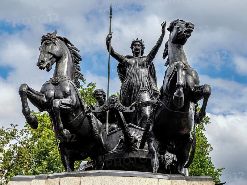 Thomas Thornycroft's bronze monument to Boudica and her daughters, completed in 1902, shows the Iceni queen driving a scythed chariot beside Westminster Bridge. It commemorates her revolt against Roman rule around AD 60 and became a Victorian symbol of resistance, London, England, United Kingdom