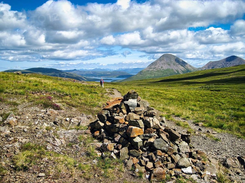Bruach na Frithe hiking trail, distinctive cairn, orientation, signpost, grassy, rolling moorland, cone-shaped mountain Marsco, hikers on the horizon, Red Cuillin, Cumulus, Scottish Island, Isle of Skye, Inner Hebrides, Scotland, Great Britain