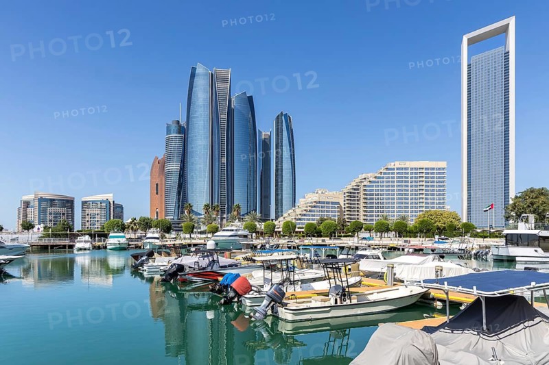 Abu Dhabi Skyline Etihad Towers skyscrapers with marina yacht harbor in Abu Dhabi, United Arab Emirates