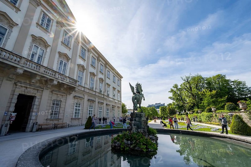 Mirabelle Garden with Pegasus Fountain and Mirabell Palace, Sun Star, Hohensalzburg Fortress in the back, Salzburg, Austria