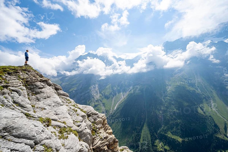 Mountaineers in front of picturesque mountain scenery at the summit of Tanzbödeli, Bernese Alps, Bernese Oberland, Switzerland