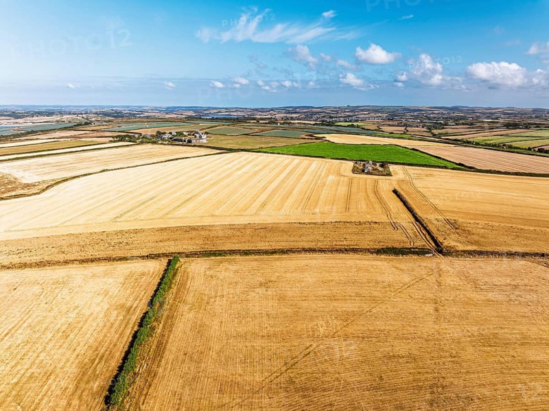 View of Fields and Farms over Cliffs and Trevone Bay from a drone, Trevone, Padstow, Cornwall, England, United Kingdom, Summer 2026