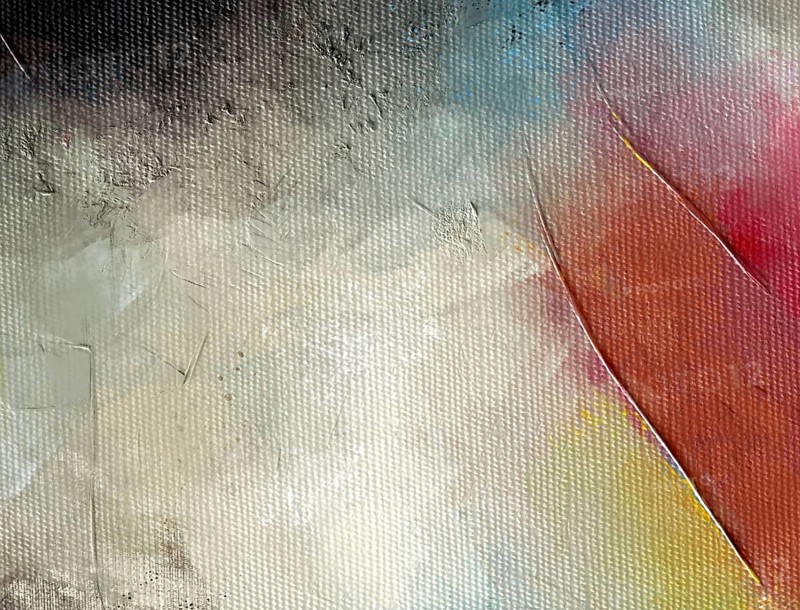 Abstract oil fragment featuring white, blue, and pink textures