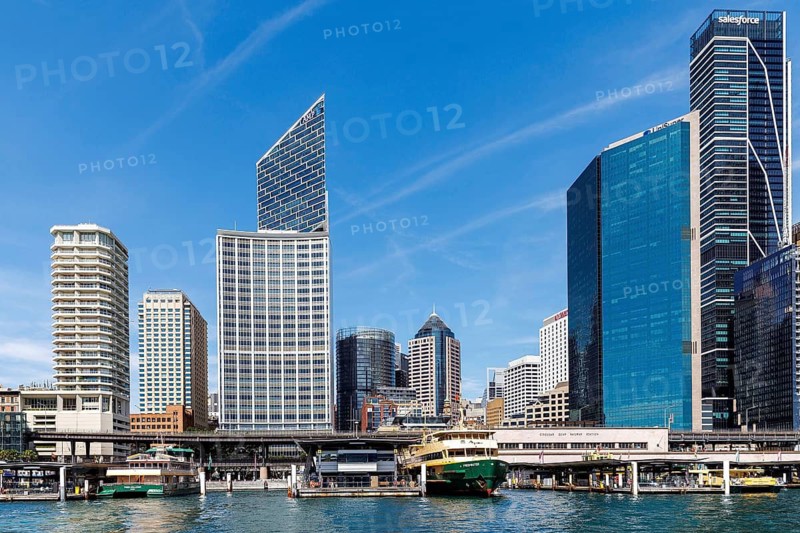 Tall skyscrapers of the CBD rise above the Circular Quay Ferry Terminal, Sydney, Australia