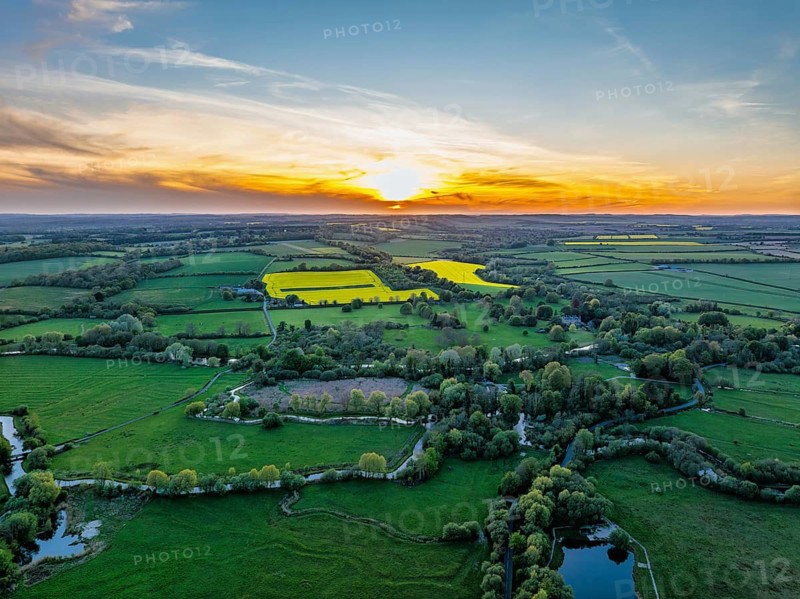 Sunset of Fields and Farms over Horsebridge nad Stockbridge from a drone, Hampshire, England, United Kingdom