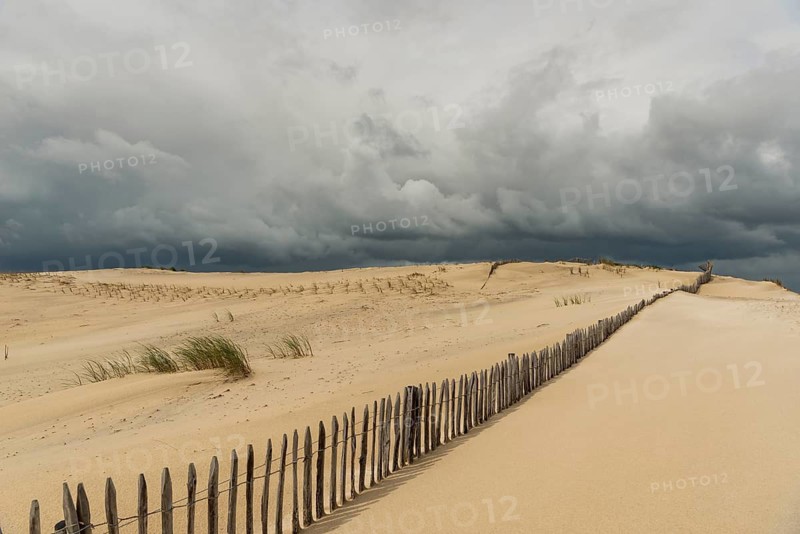 Emerging storm in sunshine in the dunes on the Atlantic coast, Soulac-sur-Mer, France