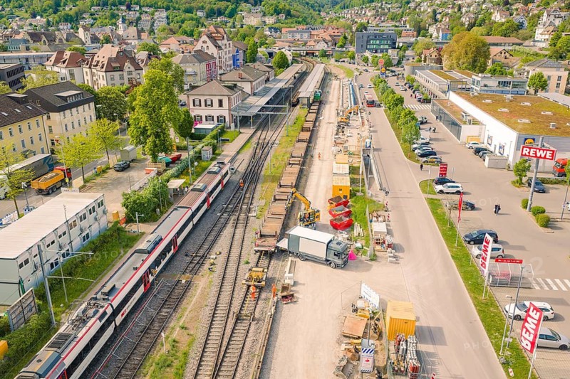 View of railway line and adjacent construction in an urban environment, construction site by Leonhard Weiss to renovate the station and build the overhead line, Waldshut, Germany