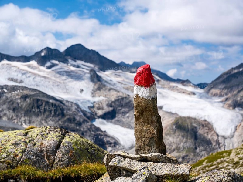 Spitzer Stein as a trail marker, glaciated mountains behind, Venice Group, Hohe Tauern National Park, Province of Salzburg, Austria