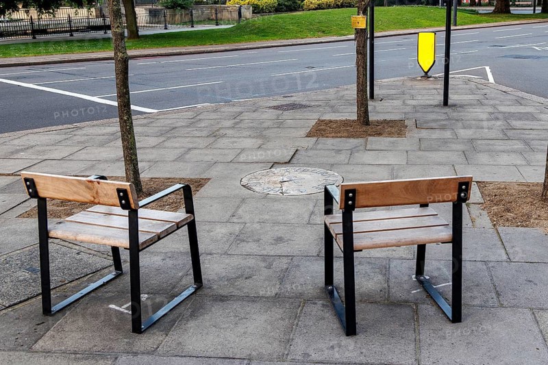 Secret London, Contemporary wooden benches overlook the Tyburn Tree site marker near Marble Arch, London, United Kingdom