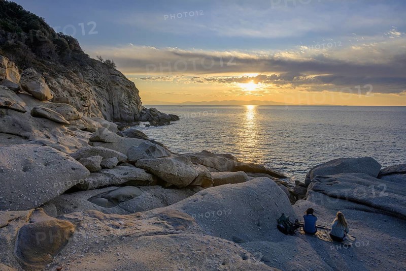 Rock formations in the evening light on, Capo Sant Andrea, Marciana, Livorno Province, Italy